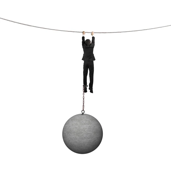 Businessman shackled by heavy concrete ball hanging on the rope — Stock Photo, Image