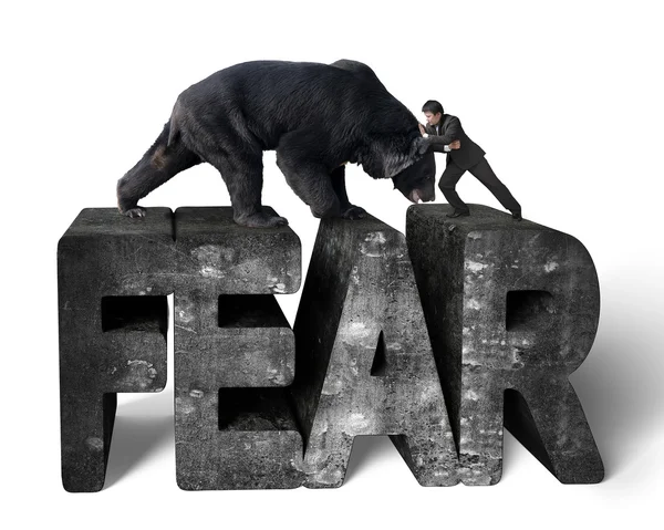 Businessman fighting against black bear on 3d fear concrete word — Stock fotografie