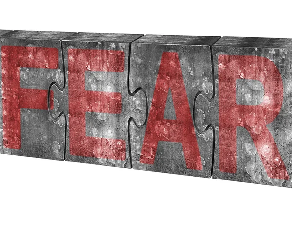 Red fear word on huge concrete puzzles isolated on white — Stok fotoğraf