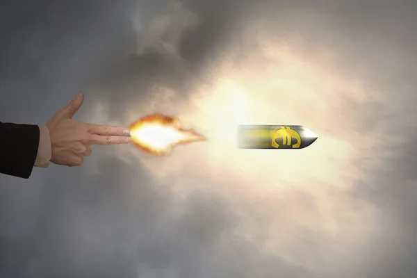 Hand of gun gesture with firelight shooting euro sign bullet — Zdjęcie stockowe
