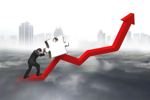 Business man pushing 3D jigsaw puzzle upward red trend line — Stock Photo, Image