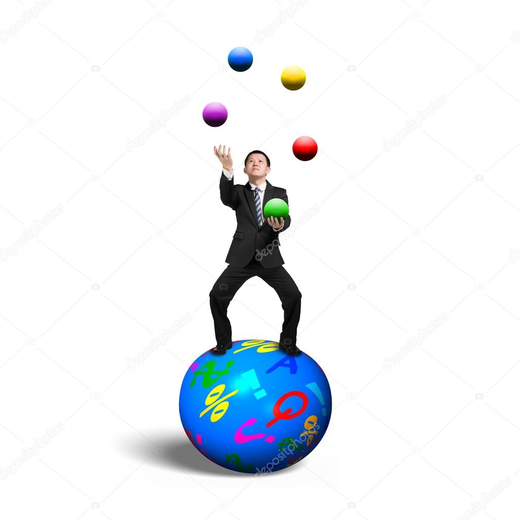 Businessman balancing on sphere juggling with balls