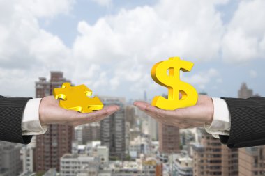 Dolar işareti ve bulmaca parçası iki elle