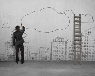 Businessman drawing clouds with copy space on concrete wall
