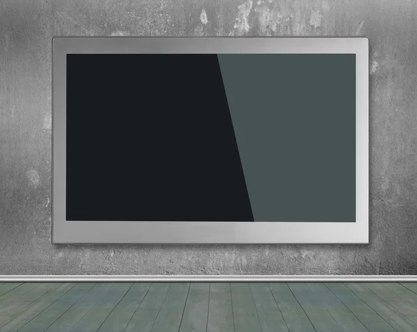 Blank black wide flat TV screen hanging on wall — ストック写真