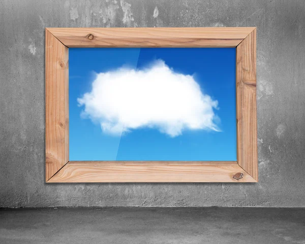 Wood frame window with view of  white cloud blue sky — Stock fotografie