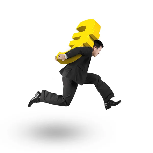 Jumping businessman carrying 3D golden euro sign — Stok fotoğraf