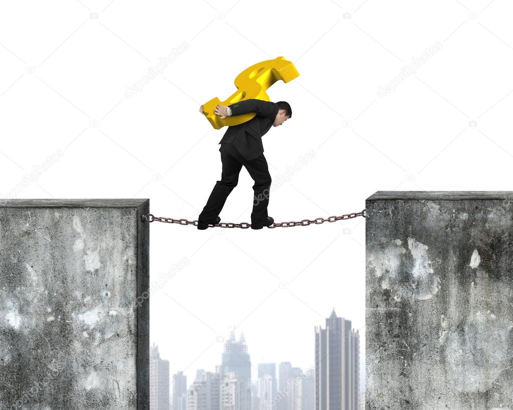 Businessman carrying golden dollar sign balancing on rusty chain