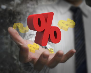 Businessman hand showing red percentage sign with golden dollar