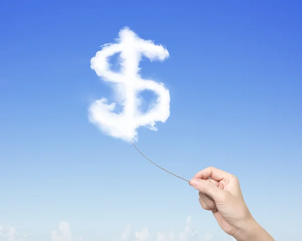 Woman hand pulling rope connected with dollar sign clouds — Stock Photo, Image