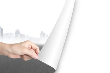 Woman hand open blank white page replace gray cityscape