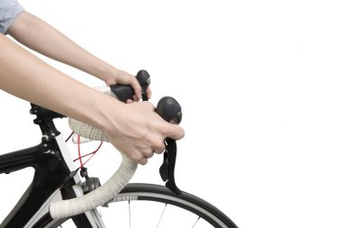 Closeup on woman hands riding a bike