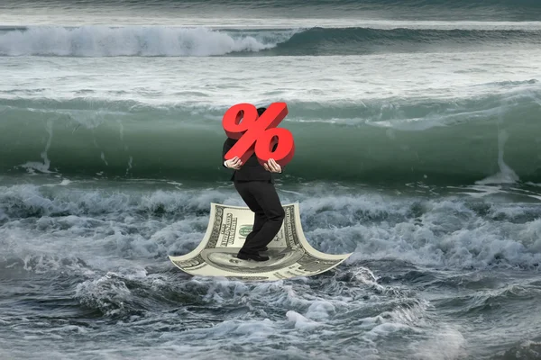 Businessman carrying 3D percentage on money boat with oncoming w — Stock Photo, Image