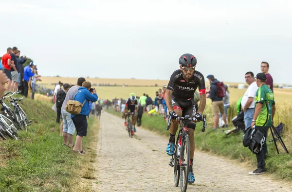 Jose Joao Mendes Pimenta Costa Riding on a Cobblestone Road - To — Stock Photo, Image