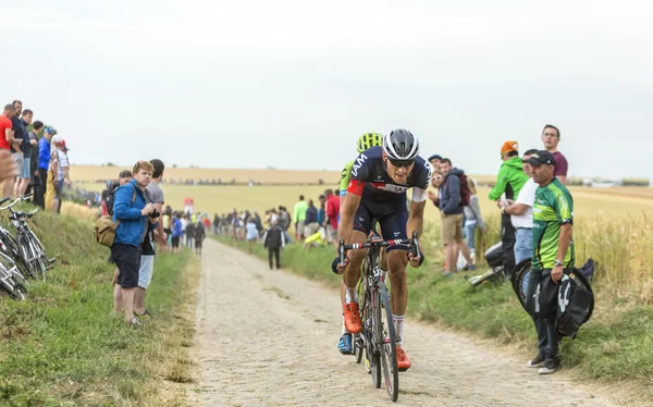 The Cyclist Matthias Brandle Riding on a Cobblestone Road - Tour — Stock Photo, Image