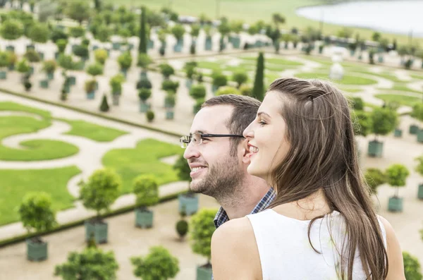 Couple enjoying beautiful French garden — Stock Photo, Image