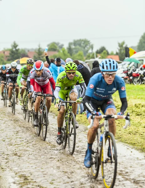 The Peloton on a Cobbled Road- Tour de France 2014 — Stock Photo, Image