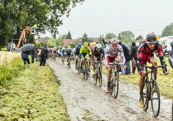The Peloton on a Cobbled Road- Tour de France 2014 — Stock Photo, Image