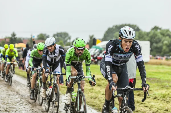 The Peloton on a Cobbled Road- Tour de France 2014 — Stock Photo, Image