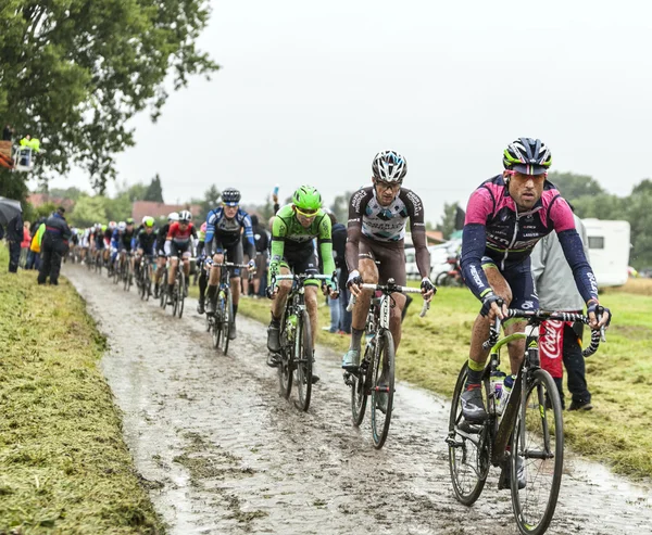 The Peloton on a Cobbled Road- Tour de France 2014 — Stock Photo, Image