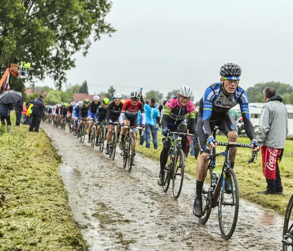 The Peloton on a Cobbled Road- Tour de France 2014 — Stock Photo, Image