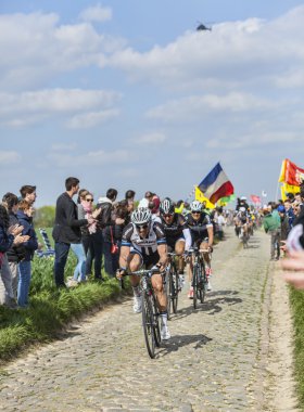 Three Cyclists on Paris-Roubaix 2014 clipart