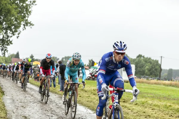 The Peloton on a Cobbled Road- Tour de France 2014 — Stock Photo, Image