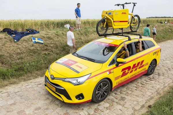 DHL Vehicle on a Cobblestone Road- Tour de France 2015 — Stock Photo, Image