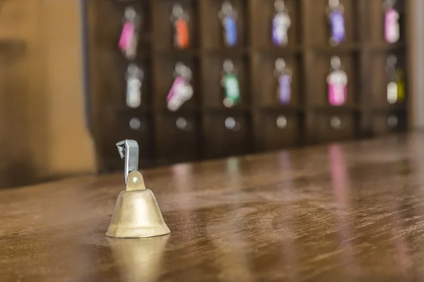 Vintage bell on a hotel reception desk — Stock Photo, Image