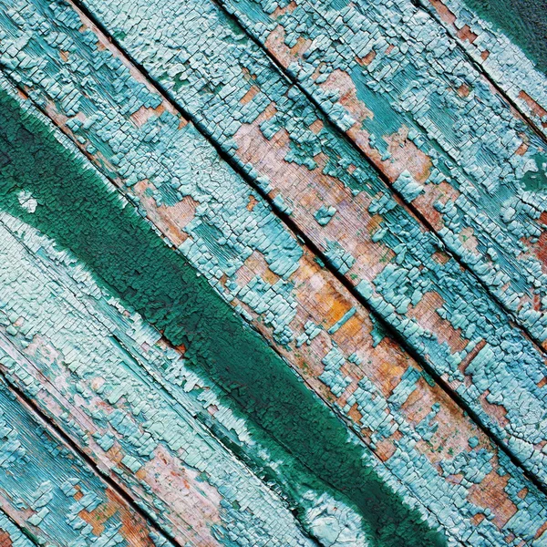 Vecchio sfondo in legno con vernice usurata e incrinata — Foto Stock