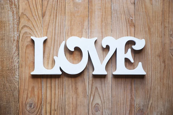 Wooden background with love word — Stock Photo, Image