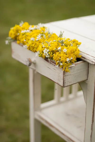 Old vintage table and flowers — Stock Photo, Image