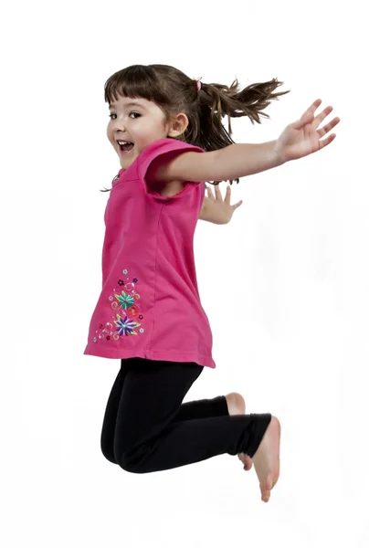 Happy little girl jumping in air — Stock Photo, Image