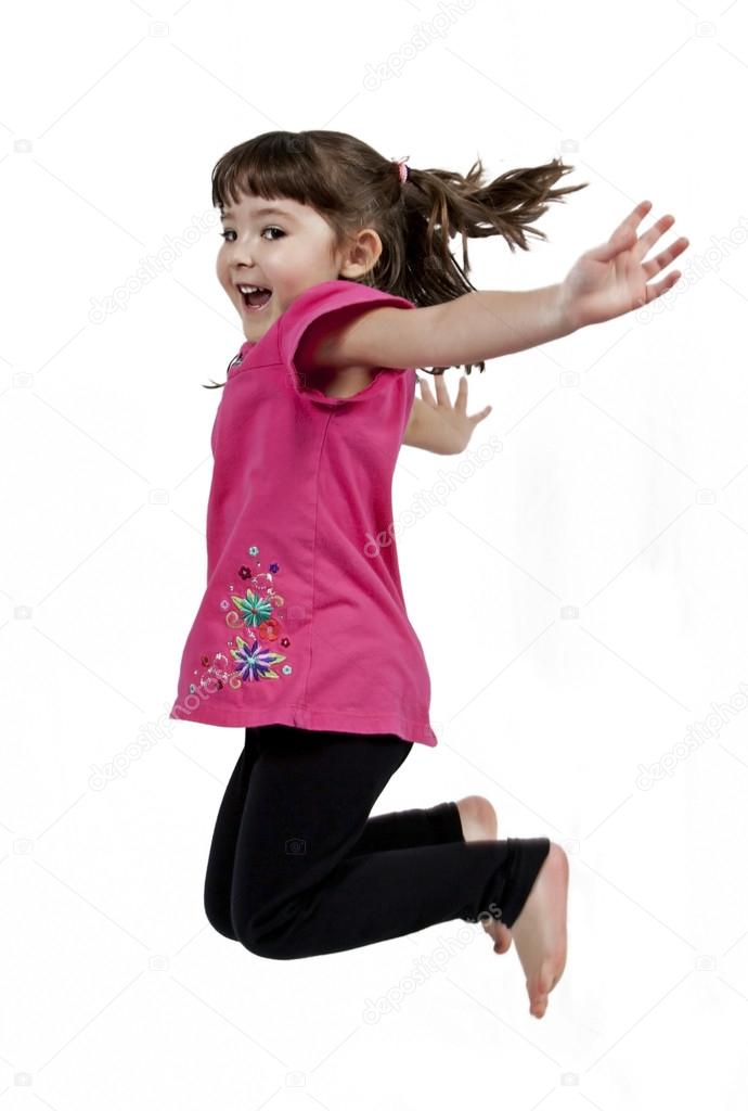 Happy little girl jumping in air