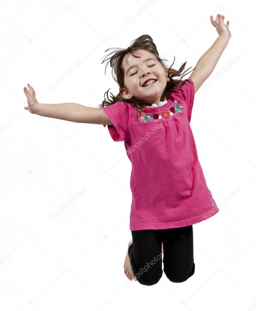 Happy little girl jumping in air