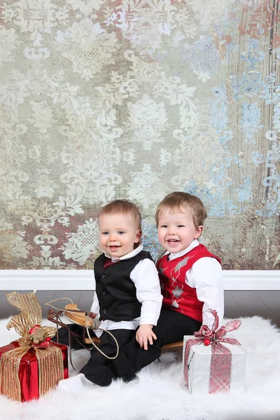 Little boys with gift boxes — Stock Photo, Image