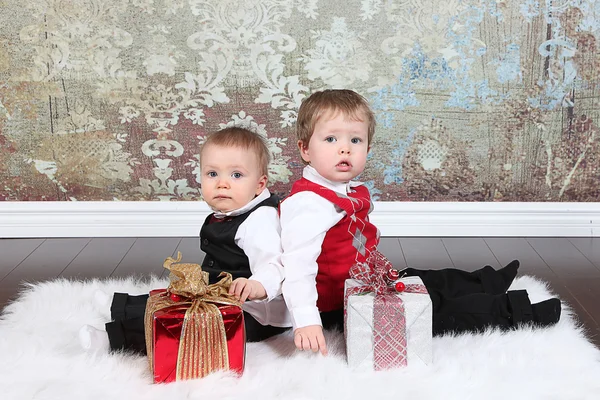 Little boys with gift boxes — Stock Photo, Image