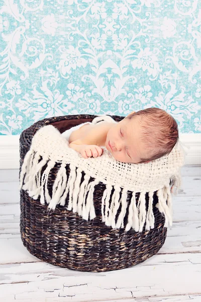 Baby boy sleeping in basket — Stock Photo, Image