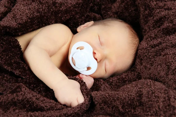 Newborn baby with soother — Stock Photo, Image