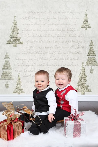 Cute little boys with gifts — Stock Photo, Image