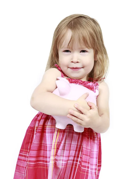 Menina com banco porquinho — Fotografia de Stock