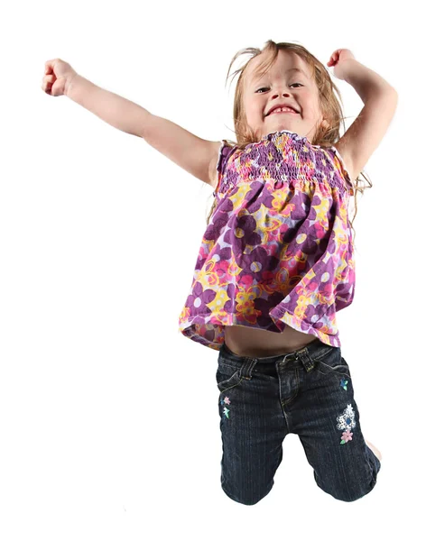 Feliz niña saltando en el aire — Foto de Stock