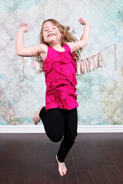 Little Girl jumping in Studio — Stock Photo, Image