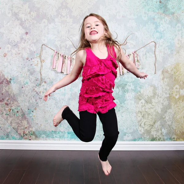Little Girl jumping in Studio — Stock Photo, Image