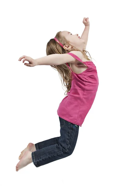 Happy little girl jumping in air — Stock Photo, Image