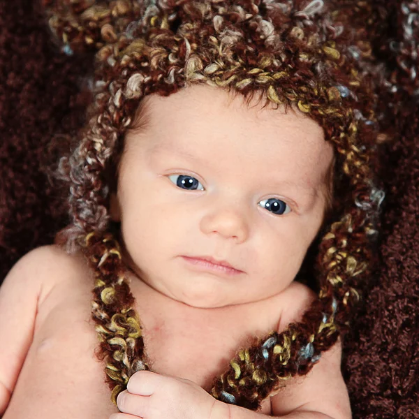 Newborn baby in funny hat — Stock Photo, Image