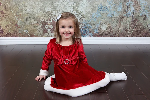 Lille pige i julekjole - Stock-foto