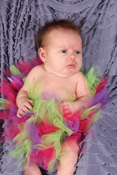 Newborn Girl in colorful skirt — Stock Photo, Image