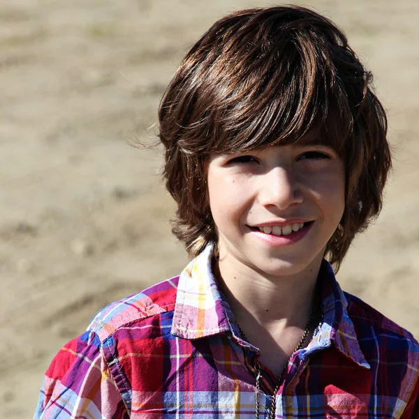 Little boy smiling outdoors — Stock Photo, Image