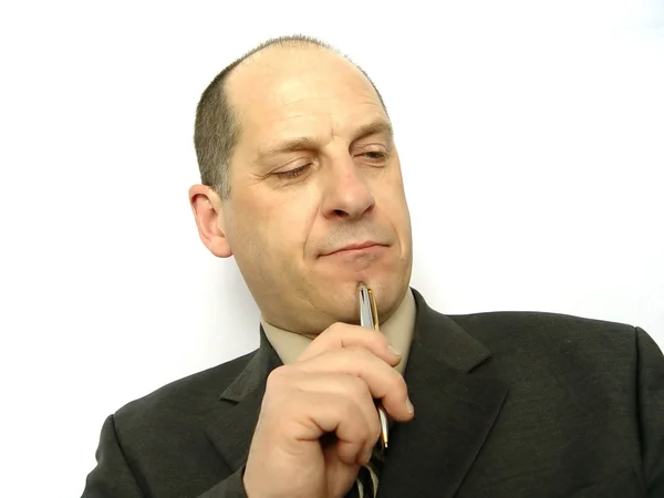 Businessman with pen to face — Stock Photo, Image